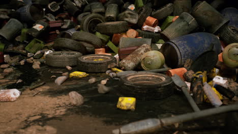 urban dump filled with discarded tires trash and debris in a polluted area