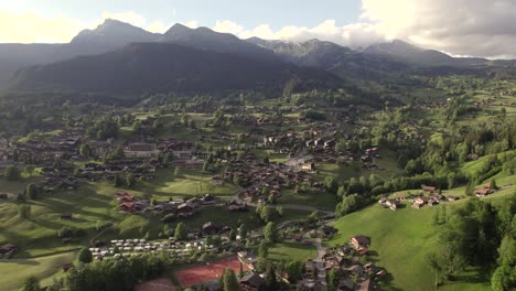 aerial-drone-footage-dolly-right-to-left-of-beautiful-sunset-view-of-grindelwald-village-in-the-swiss-alps