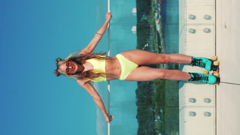 woman in yellow bikini and turquoise rollerskates on a city rooftop