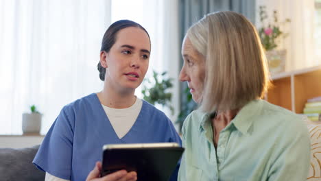nurse visiting senior woman at home