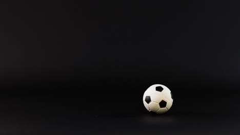 a football bouncing on a dark background