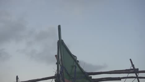 slowmo and cinematic shot of a fishing boat docked at the shore