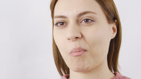 close-up of woman eating sunflower seeds.