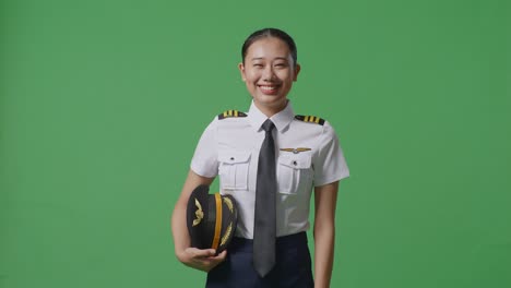 smiling woman pilot in uniform