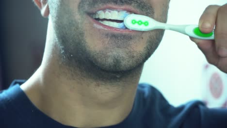 man brushing his teeth