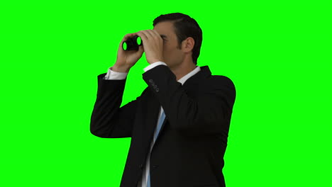 businessman looking through binoculars