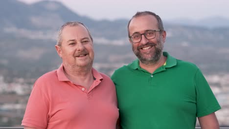 two men smiling outdoors