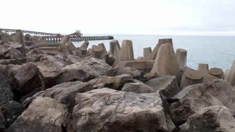 concrete formed coastline defence geometric shape engineering on waterfront dolly left move