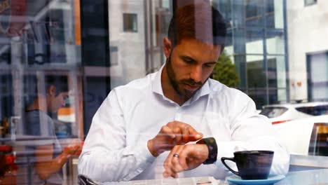 businessman reading newspaper in office