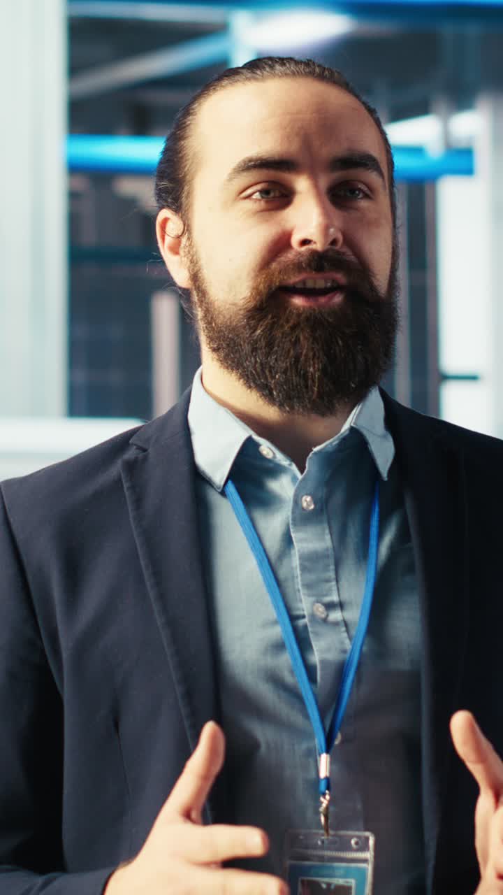 Vertical Video Man In Solar Panel Manufacturing Facility Presents Green Energy Production