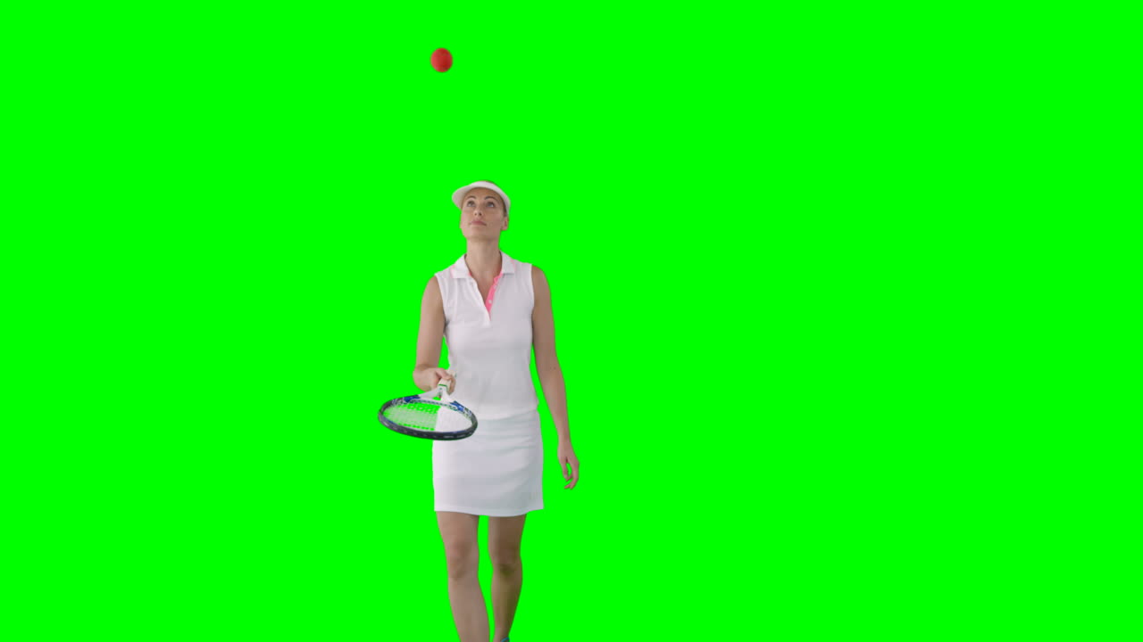 여자 테니스 선수 가 테니스 공 을 가지고 놀고 있는 앞면