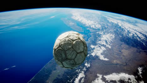 old soccer ball in space on earth orbit