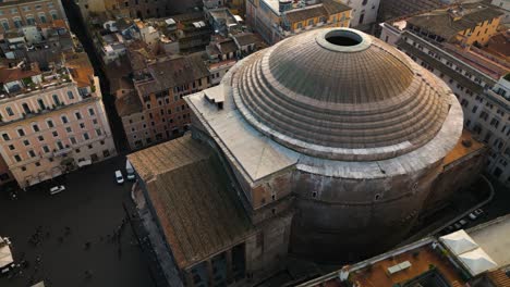 orbiting drone shot above pantheon and coffered concrete dome