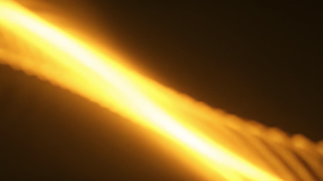 Soft, flowing lines of light dance across a warm-toned background, creating an inviting and tranquil atmosphere. The interplay of light and shadow evokes a sense of calm.