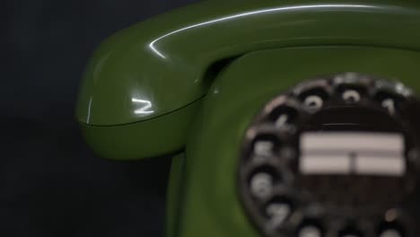 Close-up-rotary-green-vintage-phone,-analog-retro-old-telephone