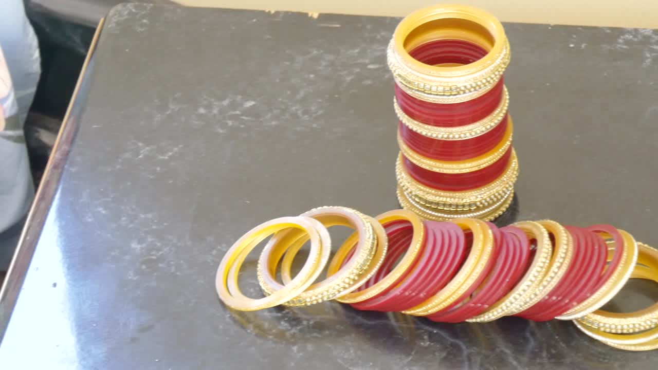 shot of golden bangles for an Indian wedding