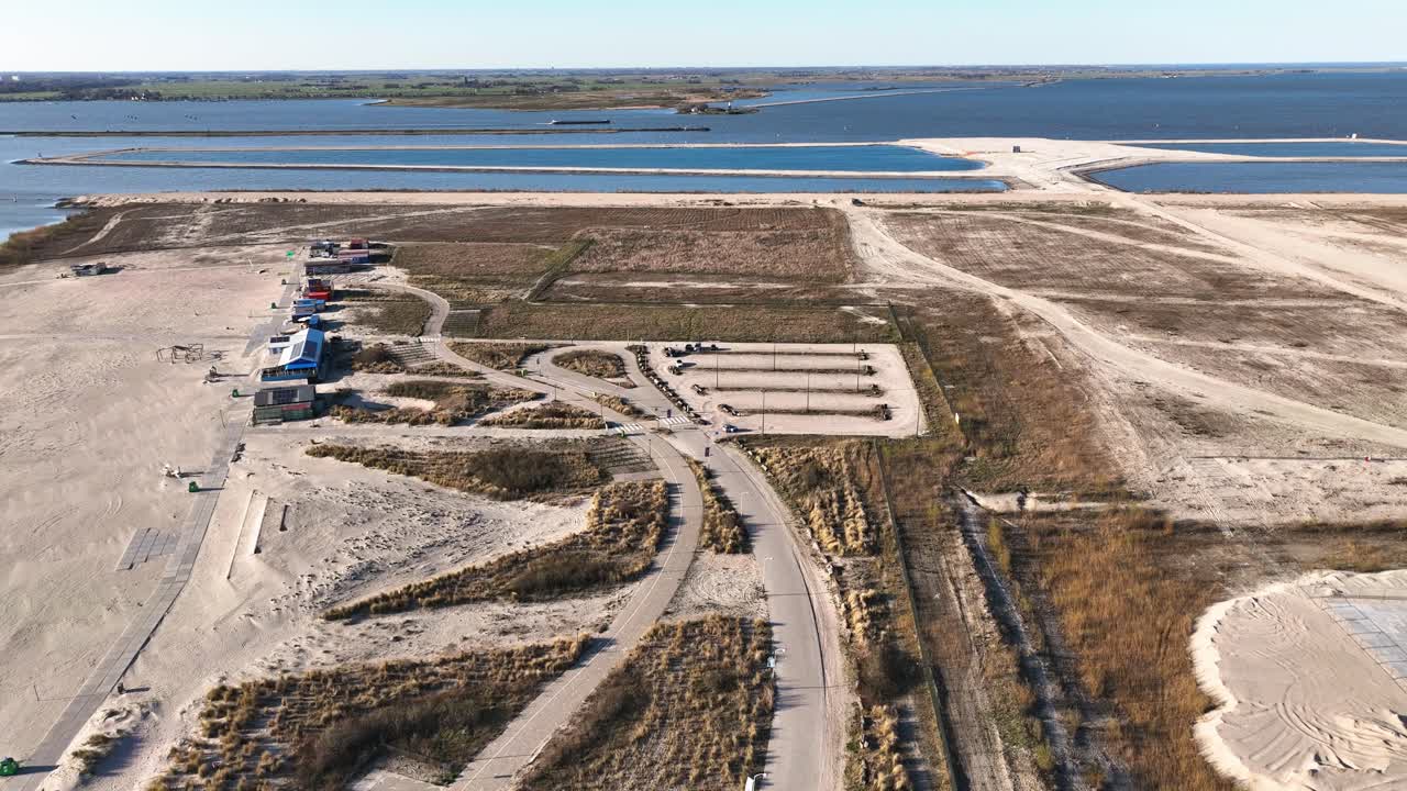 Drone footage of reclaimed land and the sea