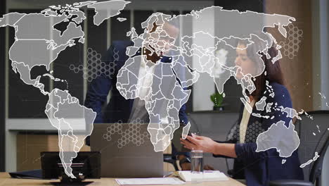 animation of world map and data processing over business people using laptop