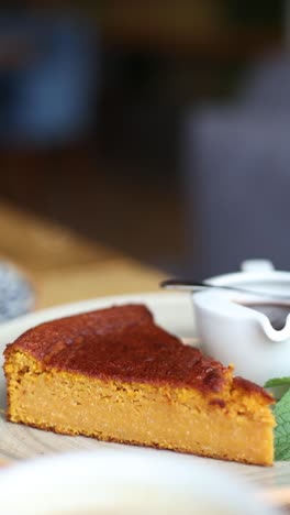 chef cutting a slice of pumpkin pie