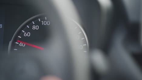 car tachometer and moving pointer, car dashboard panel detail closeup