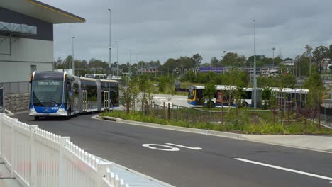 turn-up-and-go brisbane metro bus driving around rochedale depot, an innovative bus rapid transit system in queensland.