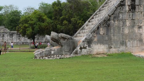 chichen itza, the heads of the feathered serpents at the base of the stairways of the kukulcan temple.
