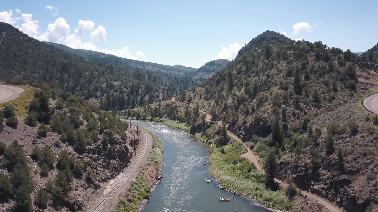 Drone flight over river rafting and paddleboarding