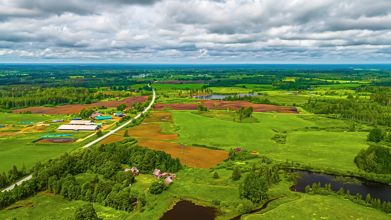 Vast green fields with clouds above in a hyperlapse nature scene