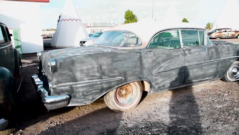 old rusted black 1950s sedan