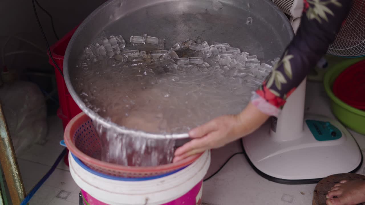 Street Food Vendor Preparing Food with Ice