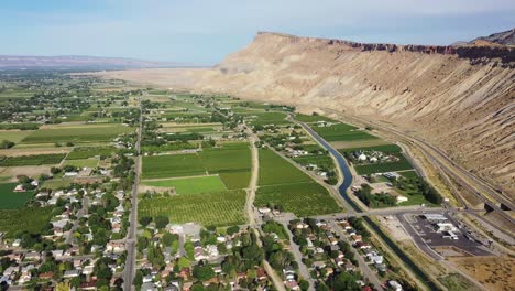 drone footage flying over palisade colorado and the palisade mountains with mt