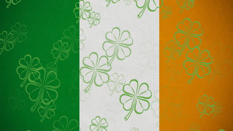 digital animation of multiple clover leaves floating against irish flag