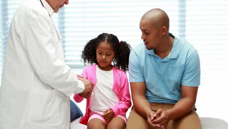 Male-doctor-examining-patient