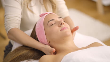 woman receiving a facial massage