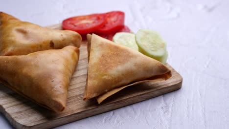 samosas with tomato and cucumber