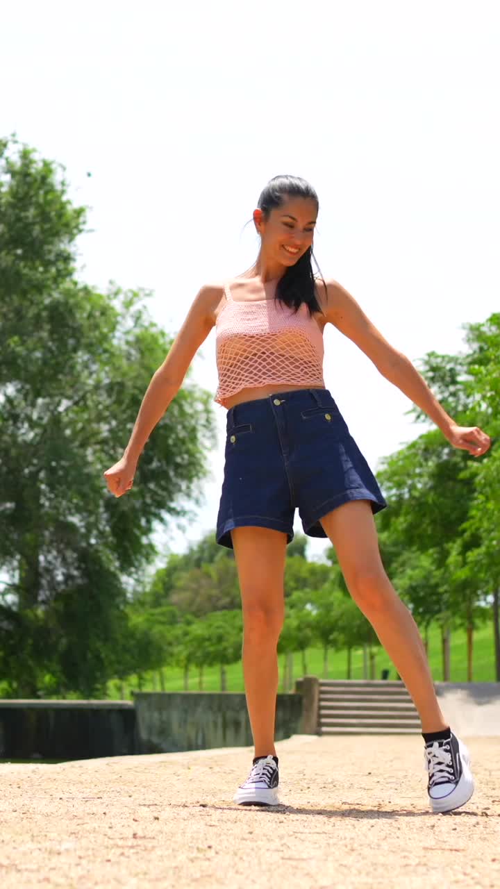 Woman in shorts exercising in park