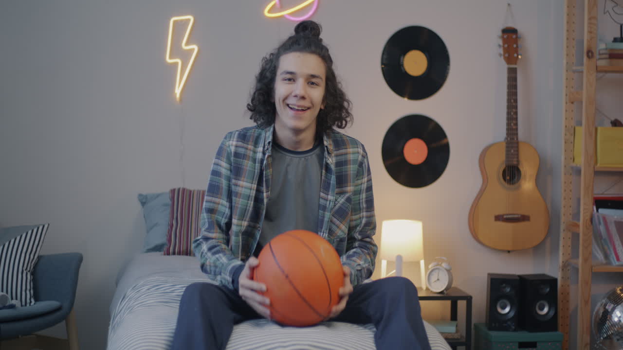 Teenager with Basketball in a Bedroom