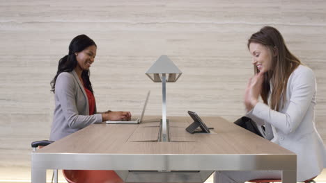 Beautiful-Smart-Business-woman-working-on-digital-table-in-lobby