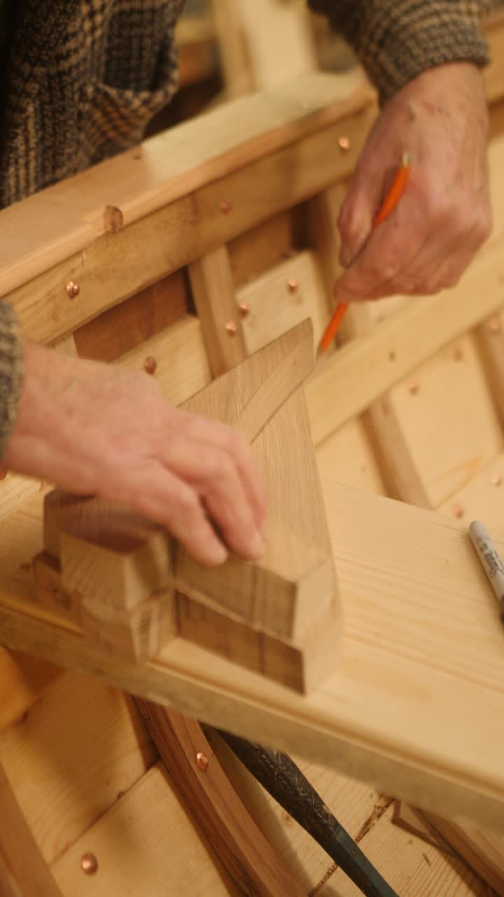 Boatbuilder tracing oak knee traditional wood boat construction