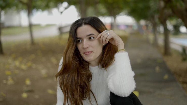 Young Woman Sitting in a Park