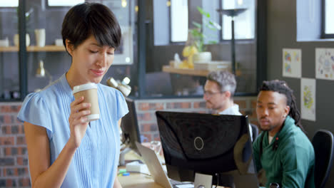 young female executive having coffee in office 4k