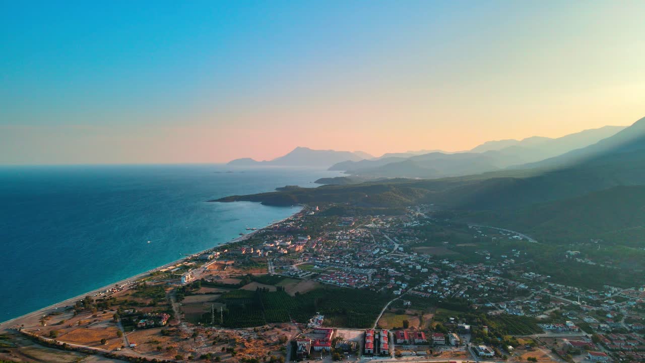 Aerial 4K drone footage of Kiriş-
Kemer , and mountains &ndash; a captivating sunset captured in vibrant summer