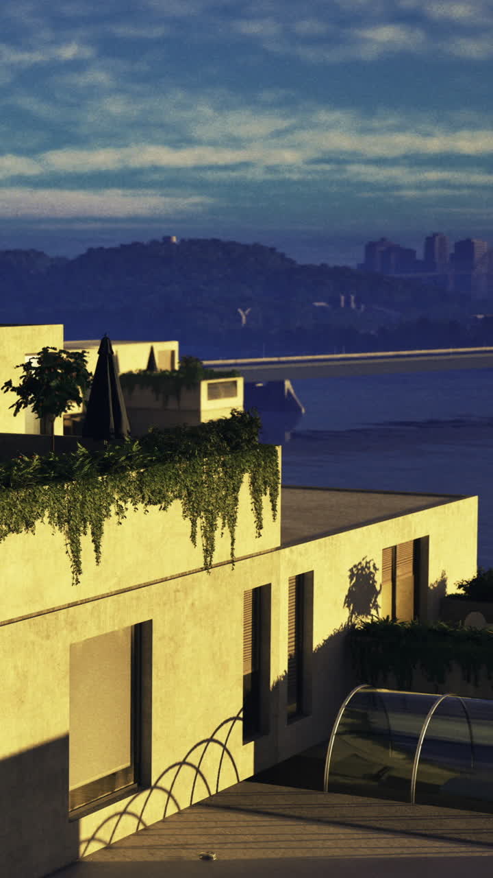 Edificio moderno con piante vicino al fiume durante il tramonto in città.
