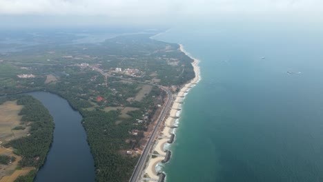 aerial view of coastal road and river in kerala, india