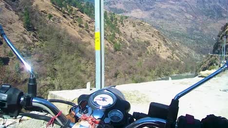 motorcycle-starting-for-road-trip-at-day-from-flat-angle-at-manali-leh-ladakh-highway-at-himachal-pradesh-india-on-Mar-22-2023