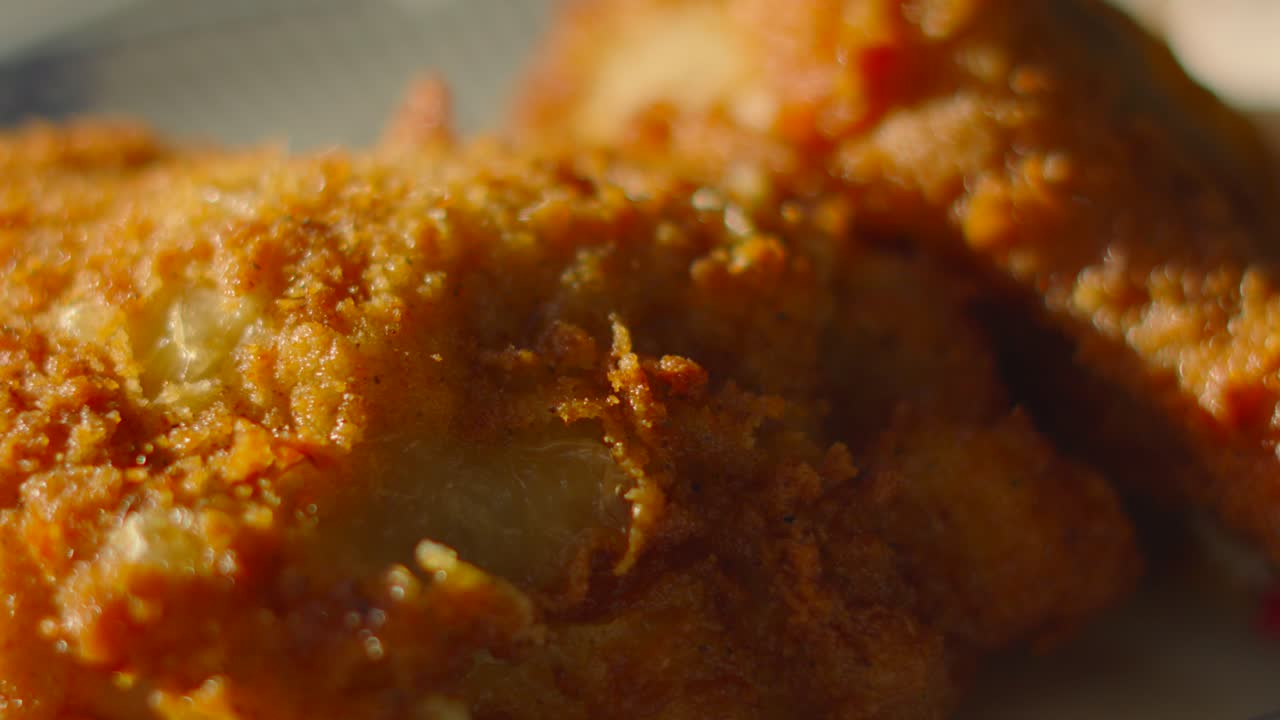 Indulgent Deep Fried Chicken Drumstick and Thigh Waiting to be Eaten. Tasty Unhealthy Fast Food with Delicious Crispy Skin.