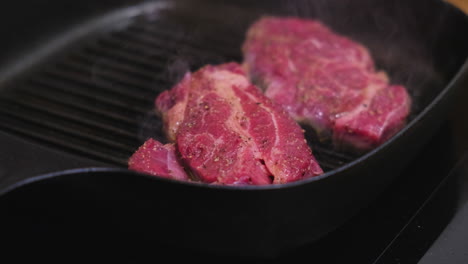 cooking steak in a pan