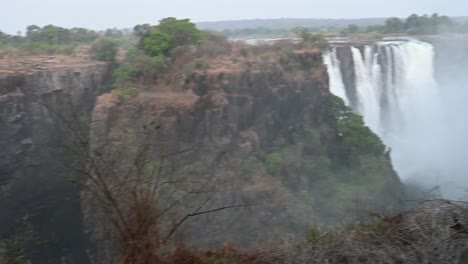 mist-rising-from-the-fallen-water-at-Victoria-Falls-waterfalls-in-Zimbabwe,-Africa