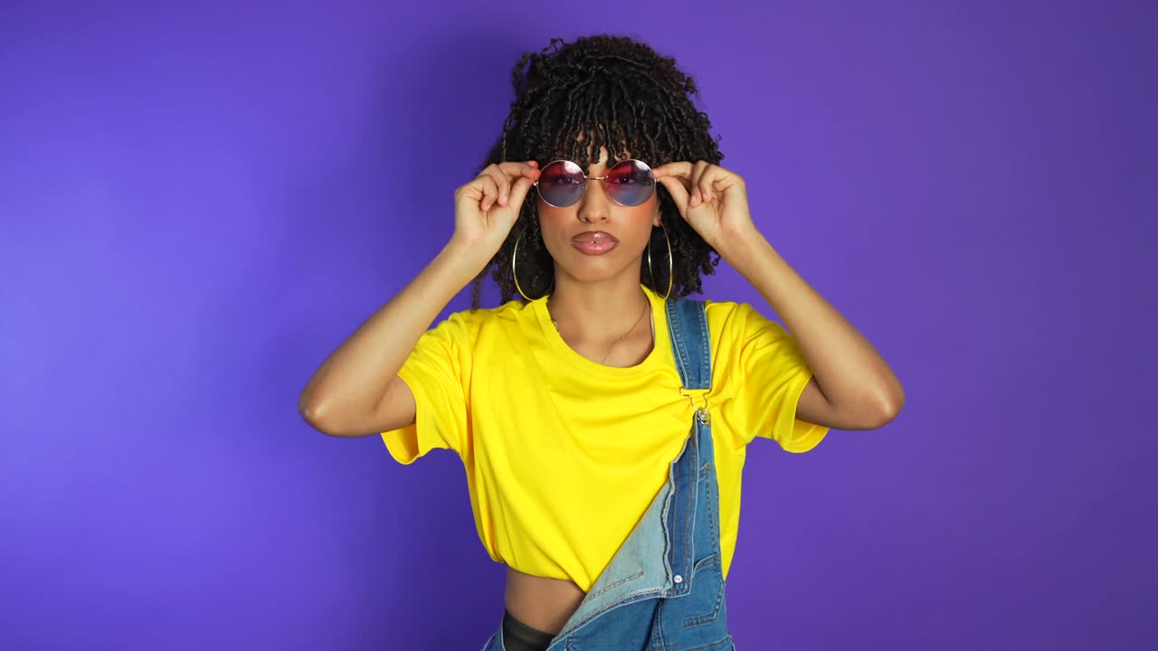 Stylish woman in yellow shirt and sunglasses