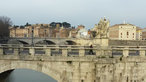 People-Walking-Across-St-Angelo-Bridge